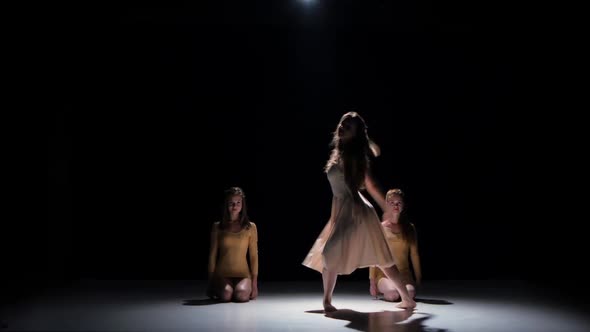 Three Beautiful Girls Dancing Modern Contemporary Dance, on Black, Shadow