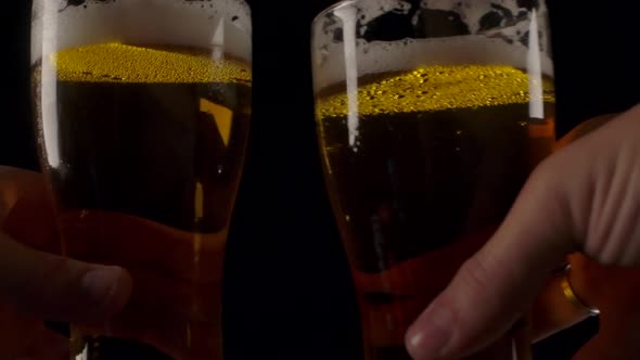 Crop People Clinking Beer Glasses