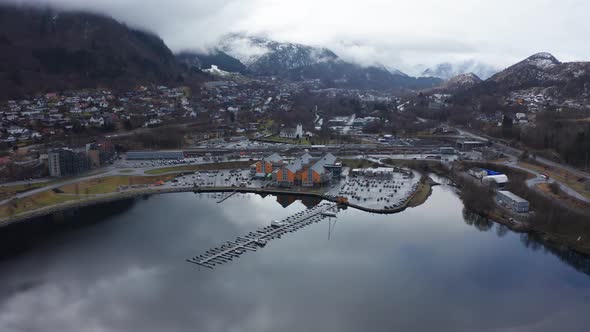 Arna city centre with railroad, parking, shopping centre and train station. Beautiful seawater refle