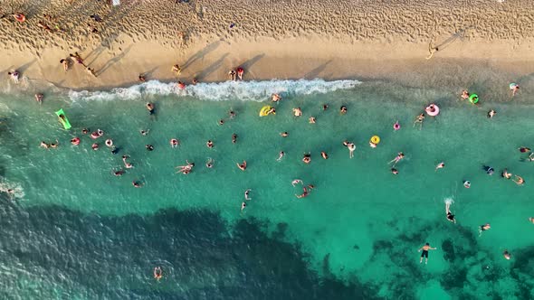 People swim in the azure sea aerial view 4 K Turkey Alanya