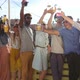 Cheerful multi-ethnic friends standing at rooftop and toasting towards camera - VideoHive Item for Sale