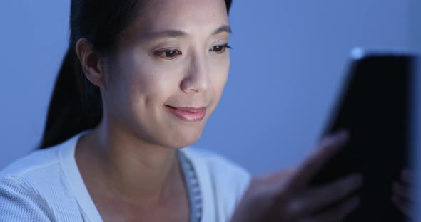 Woman use of tablet computer at home