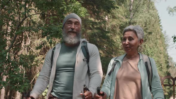 Cheerful Old People on Walk in Forest