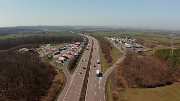 Forwards Tracking Car Turning Onto Petrol Station From Multilane Highway Autobahn in Germany