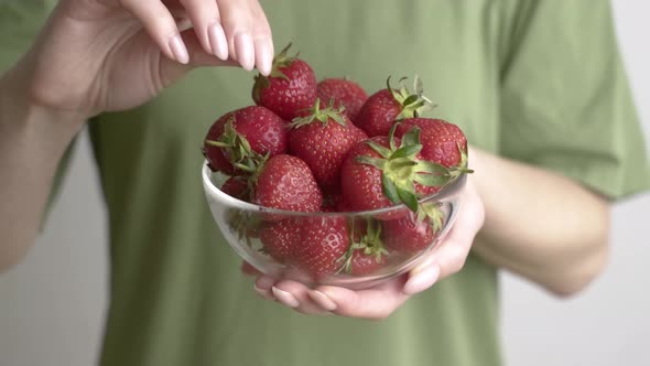 Woman Takes Strawberries