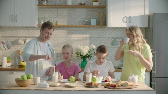 Happy Family Having Healthy Breakfast at Home