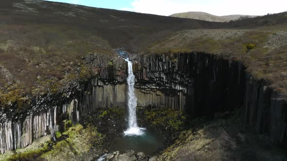 Aerial View of the Svartifoss Waterfall Surrounded By Basalt Columns in Iceland