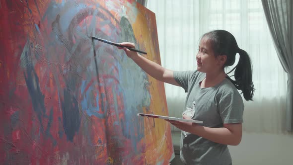 Asian Girl Painting Abstract At Home