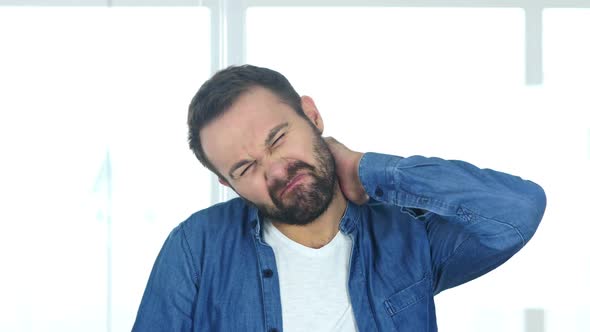 Tired Beard Man at Work Sitting in Office