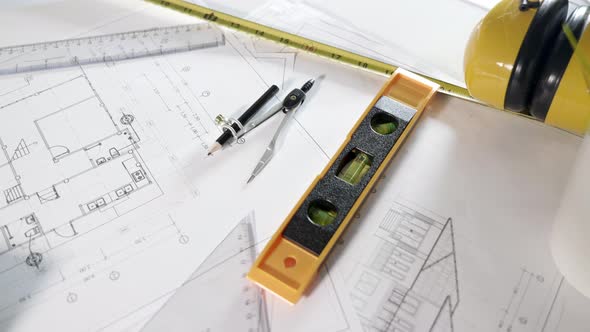 Top view of house plan blueprint paper with repair tools on table desk at architecture office