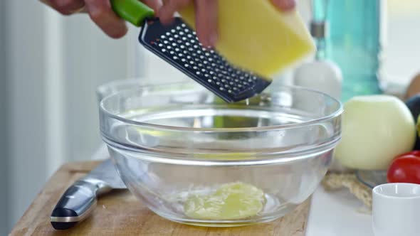 Cook Grating Cheese