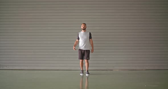 Young Adult Man Warming Up Stretching During Fitness Sport Workout