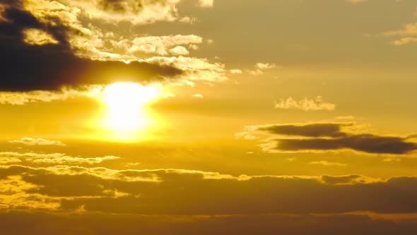 Amazing Sunset Through the Cumulus Clouds in the Orange Sky Majestic Timelapse