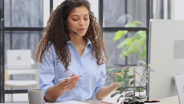 Female Customer Support Operator with Headset and Smiling