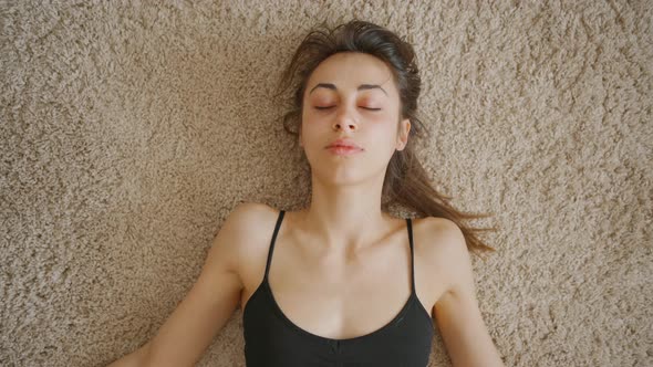 Top View Woman Relaxing After Exercises at Home