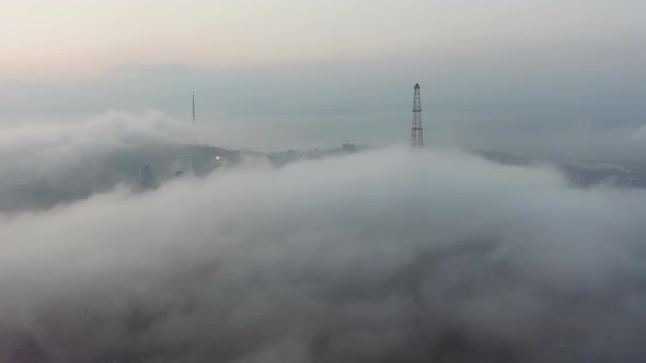 Drone View of the City Bay and Big Bridge Covered with Fog at Sunset