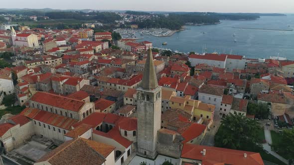 Aerial view of Euphrasian Basilica tower of Porec, Parenzo at evening