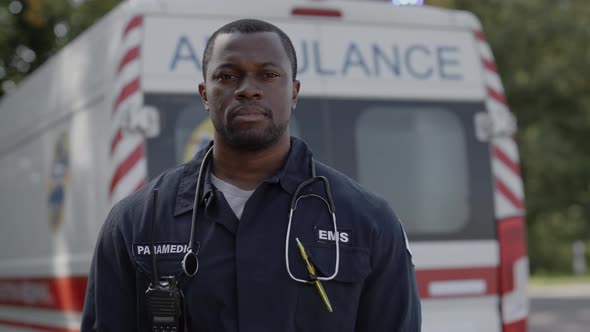 Portrait of African American Paramedic in Uniform Standing Outdoors