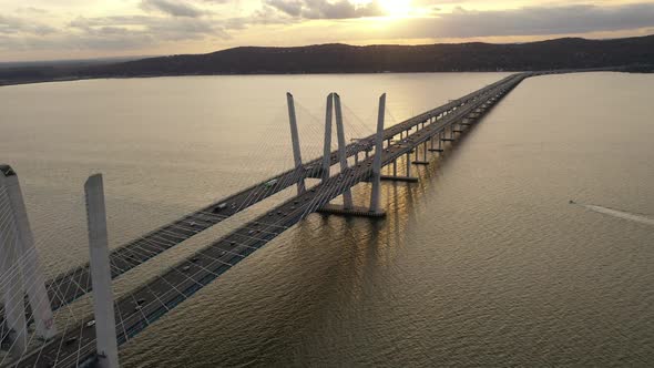 An aerial shot of the Mario M. Cuomo Bridge from the north. The camera dolly out & pan left over the