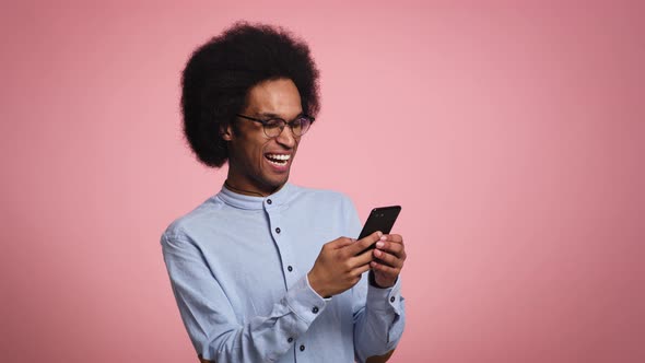 Young man very surprised with a phone in his hand