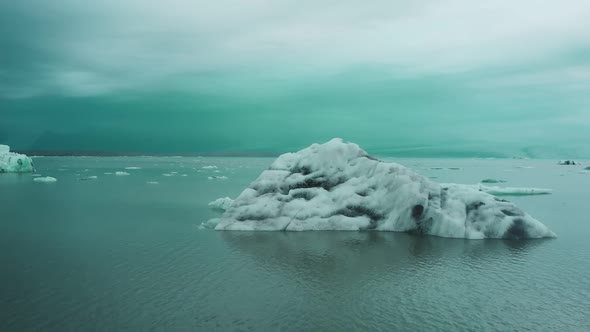 a small iceberg in the ocean