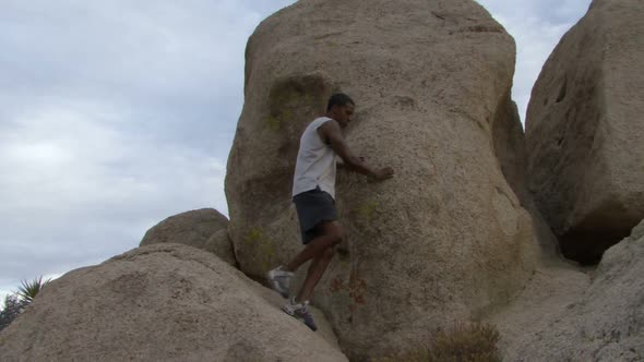 Male climbing rocks