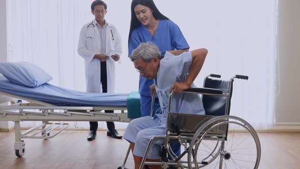 Doctor and physiotherapist caring for patient in ward