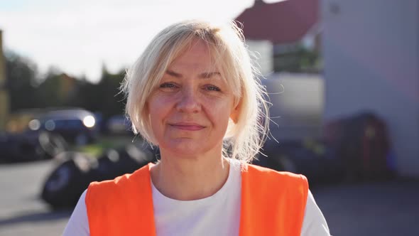 Close Up Portrait of Worker Engineer Woman with Orange Vest