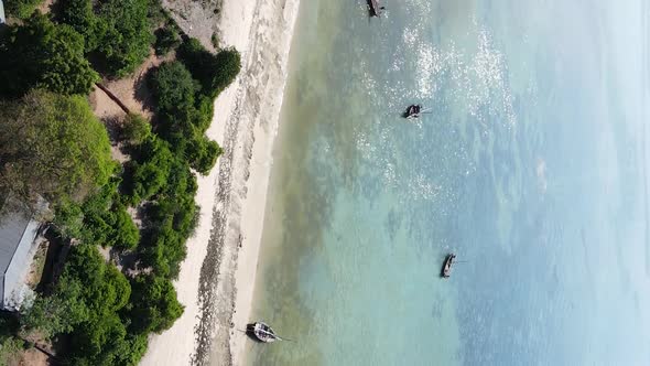 Tanzania Vertical Video  Boat Boats in the Ocean Near the Coast of Zanzibar Aerial View