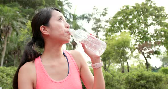 Sport woman drink of water bottle