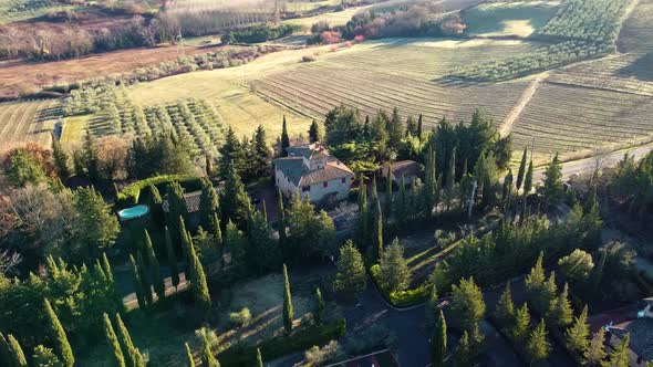 Orbiting around an estate in a cypress landscape in Tuscany, Italy