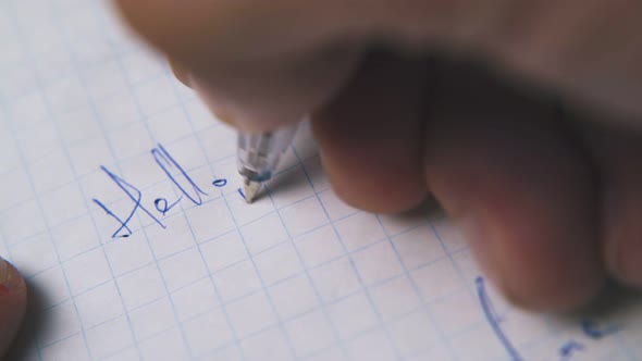 Person Writes Letter to Daddy with Pen on Checkered Paper