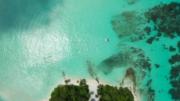 Aerial panorama of marine sea view beach trip by blue water and white sand background of a picnic in