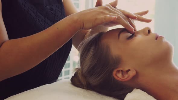 Woman Gets Facial and Head Massage in Luxury Spa