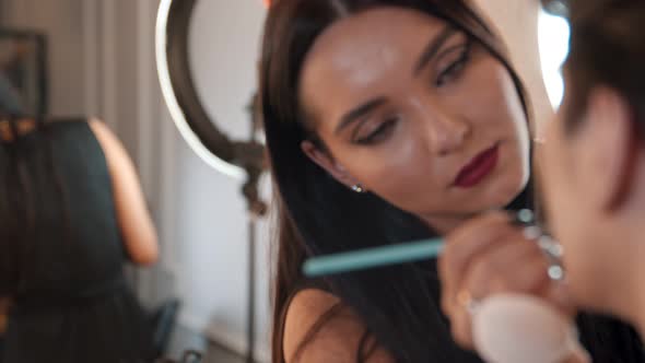 Make Up Artist Doing a Brown Bold Lips on Her Male Model - Applying Lipstick with a Brush