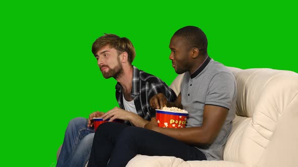 Man with Popcorn Watching Television. Green Screen