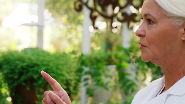 Female scientist counting plants