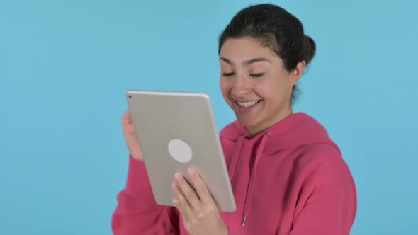 Video Call on Tablet By Indian Girl  Blue Background
