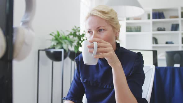 Business woman drinking coffee