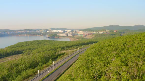 A Modern Complex of Buildings on the Shore of the Bay Surrounded By a Large Park