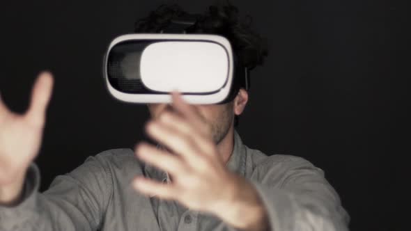 Slow motion shot of man using virtual reality simulator