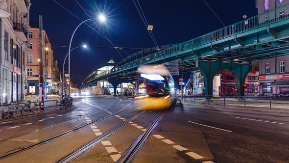 Night Time Lapse of Eberswalder Strasse with subway trams and cars Berlin, Germany