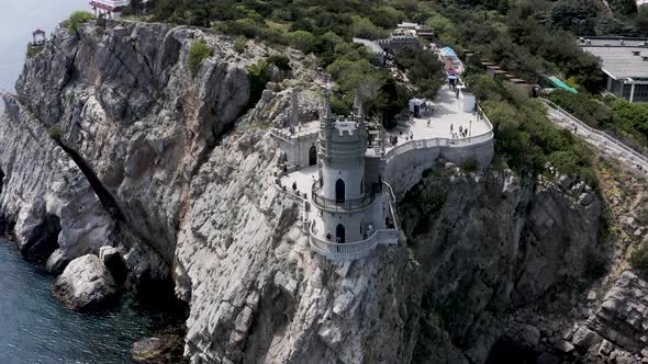Breathtaking cliff with a beautiful ancient castle above the sea