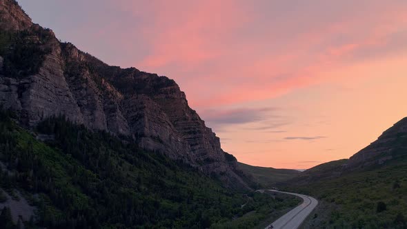 Colorful sunset in Provo Canyon viewing traffic on the highway