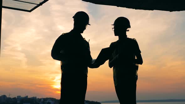 Male and Female Engineers, Architects in Work