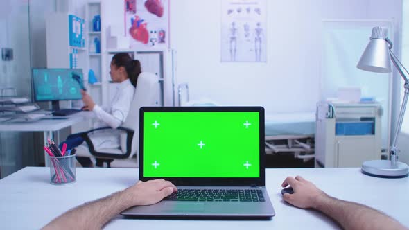 Pov Shot of Physician Using Laptop with Chroma Key