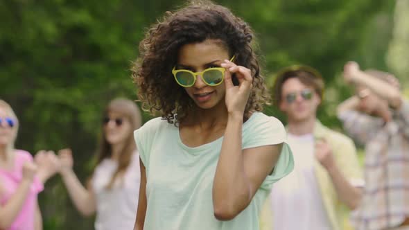 Cute Biracial Girl Dancing With Friends, Young Carefree Students at Pool Party