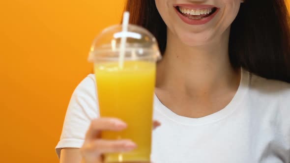 Smiling Lady Proposing Fresh Juice, Healthy Lifestyle, Vitamins and Energy