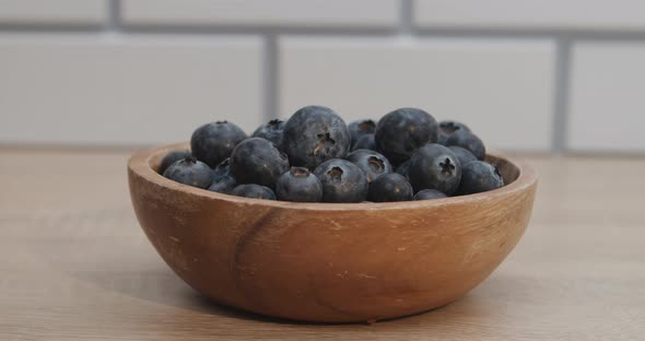 Fresh Blueberries in a Wooden Bowl