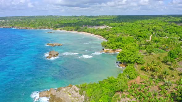 Idyllic Aerial View above Picturesque Caribbean Coastline, Lush Tropical Vegetation and Turquoise Bl